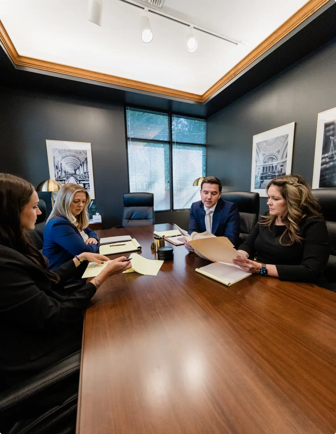 The firm's conference room during a case review