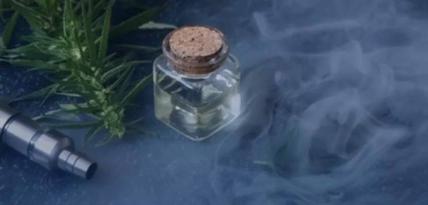 A THC vape cartridge beside cannabis and a glass jar